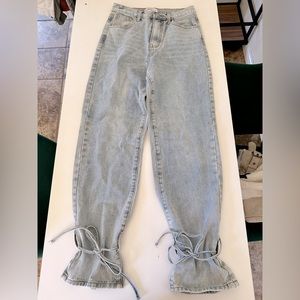 Redial denim jeans with tie detail.